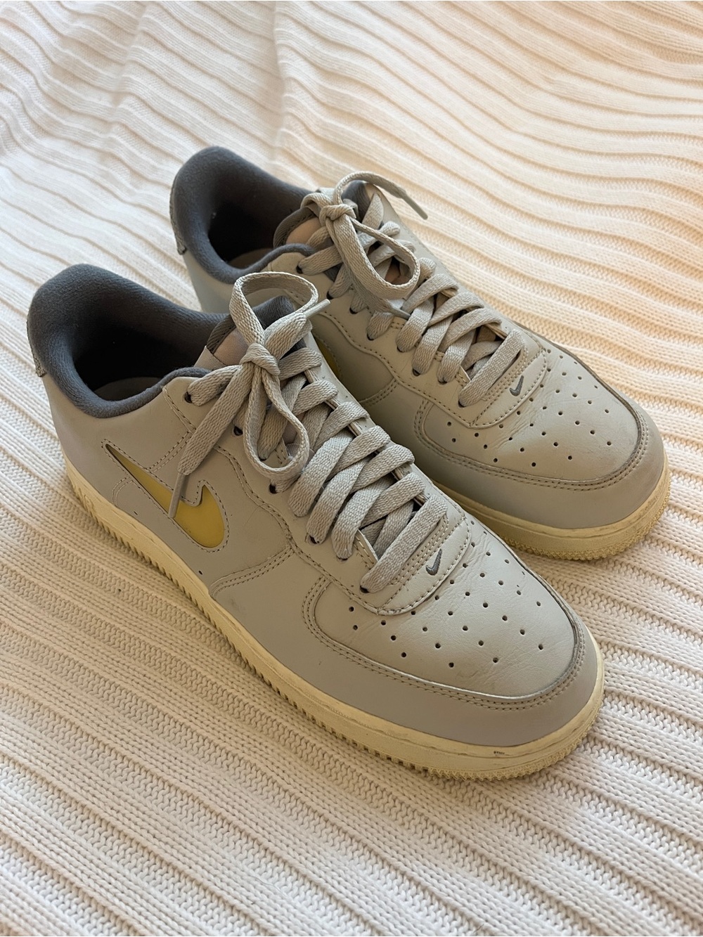 Nike Airforce 1s Men’s Low-Top Sneakers in Light Blue Gray with Yellow Swoosh